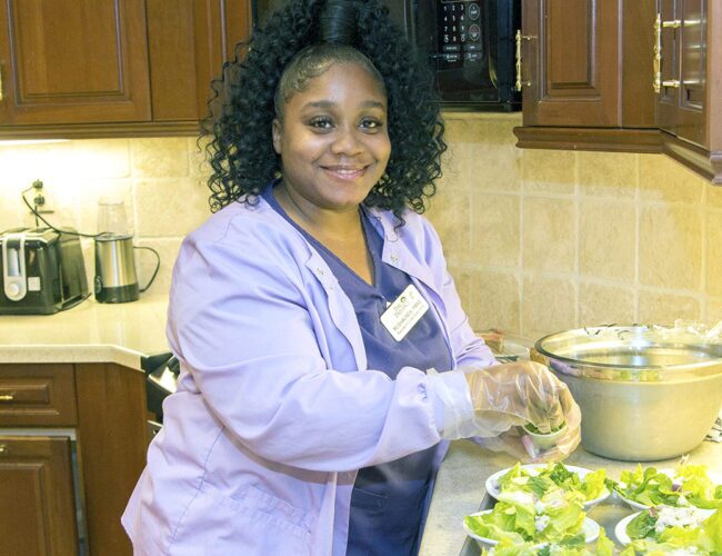 Nurse at Parc Provence preparing food for the residents