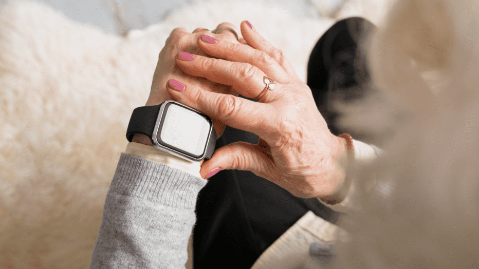 senior woman looking at a smart watch on her wrist