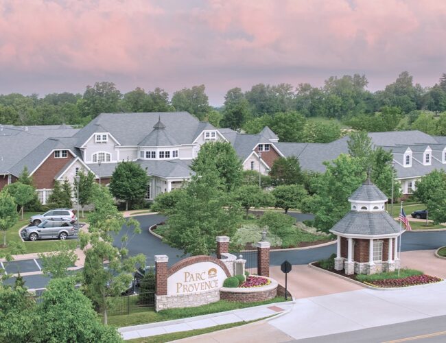 Wide angle view of the front of Parc Provence, with dramatic sky and horizon.