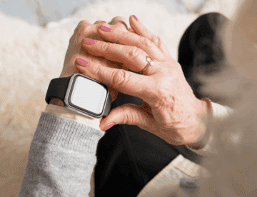 senior woman looking at a smart watch on her wrist