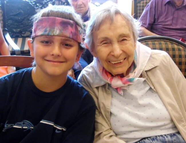 Young Man and Senior Resident enjoy Intergenerational Music Camp at Parc Provence