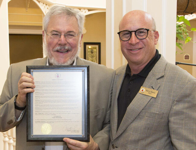 Parc Provence Co-Owner Charlie Deutsch (left) and Creve Coeur Mayor Barry Glantz at Parc's 15th-anniversary celebration