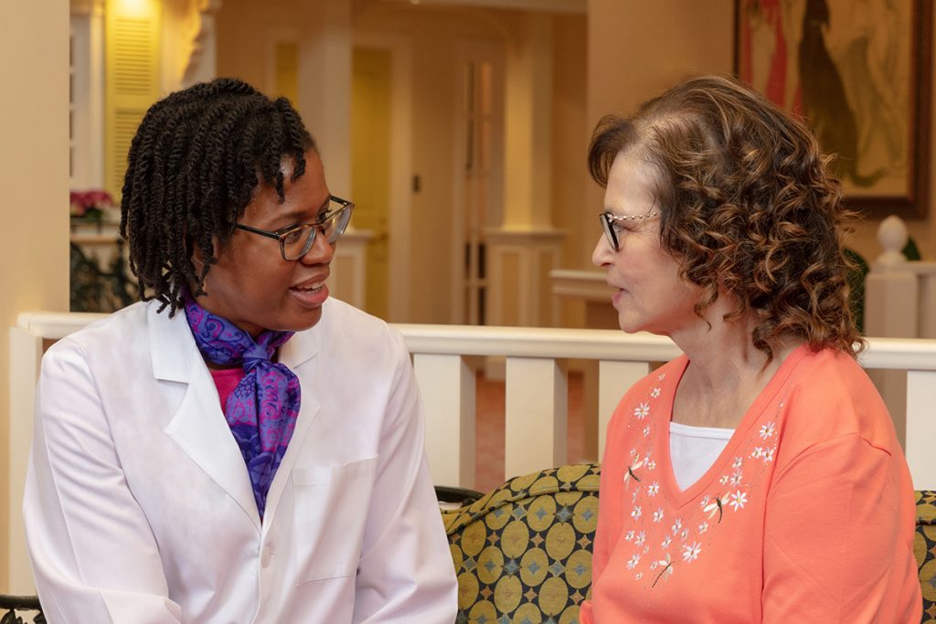 Parc Provence Associate Medical Director Dr. Lenise Cummings-Vaughn visits with a resident