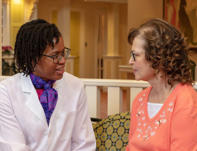Parc Provence Associate Medical Director Dr. Lenise Cummings-Vaughn visits with a resident