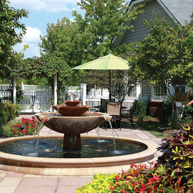 A fountain in the middle of a beautiful outdoor patio