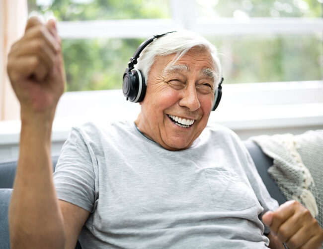 Man smiling with headphones on
