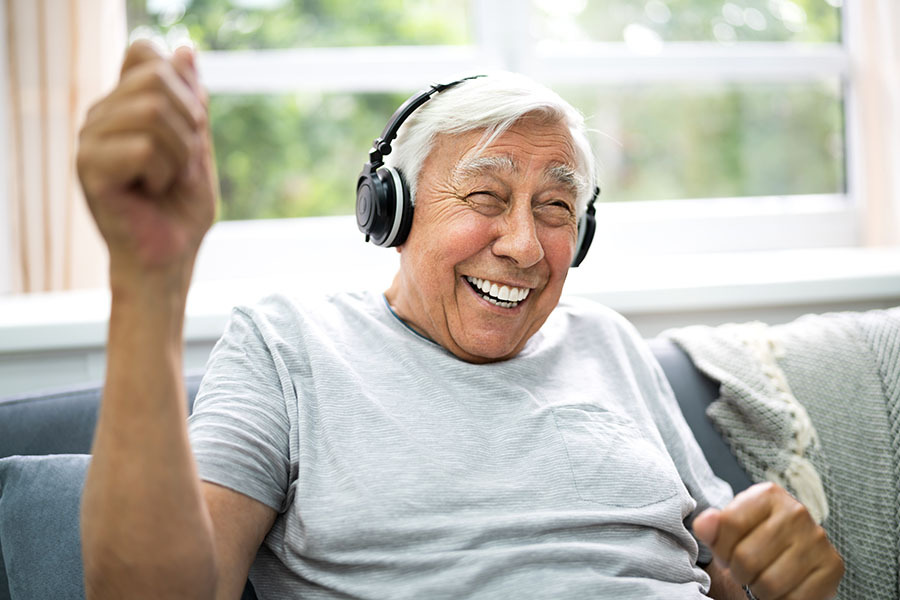 Man smiling with headphones on