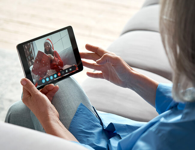 Watching somebody open a gift on a mobile device.