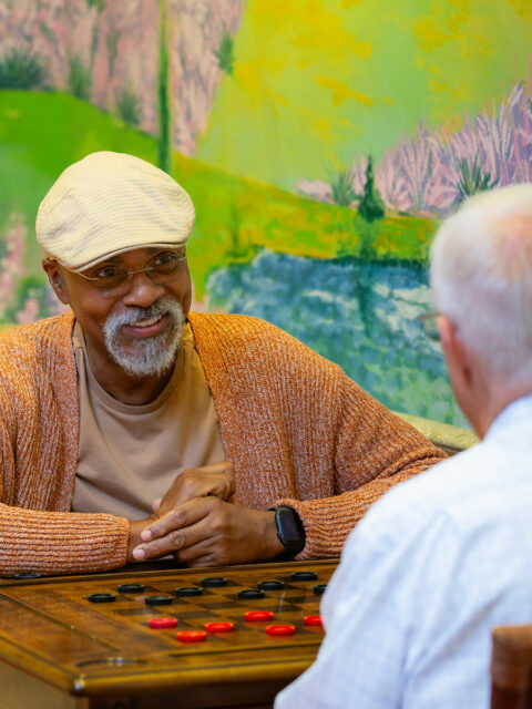 Residents playing checkers.