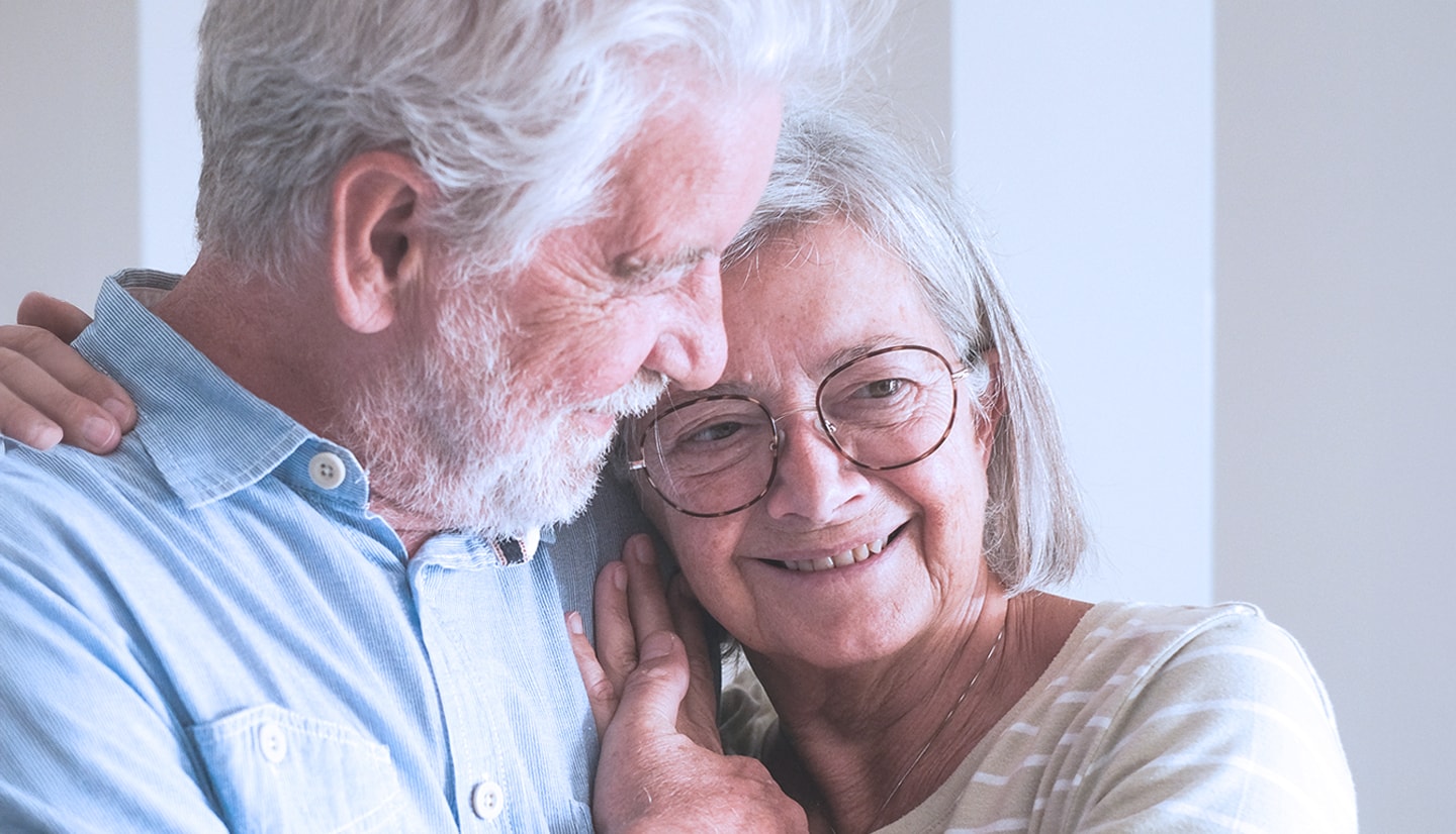 senior couple holding each other in an embrace